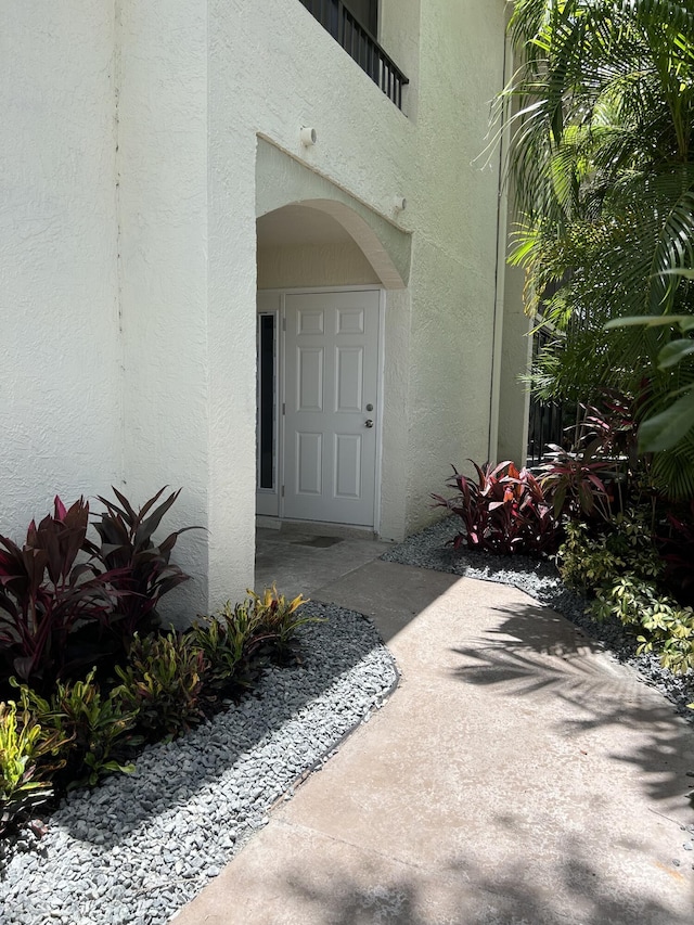 7458 Victory Ln Unit 10103, Delray Beach, FL 33446 - doorway to property with stucco siding