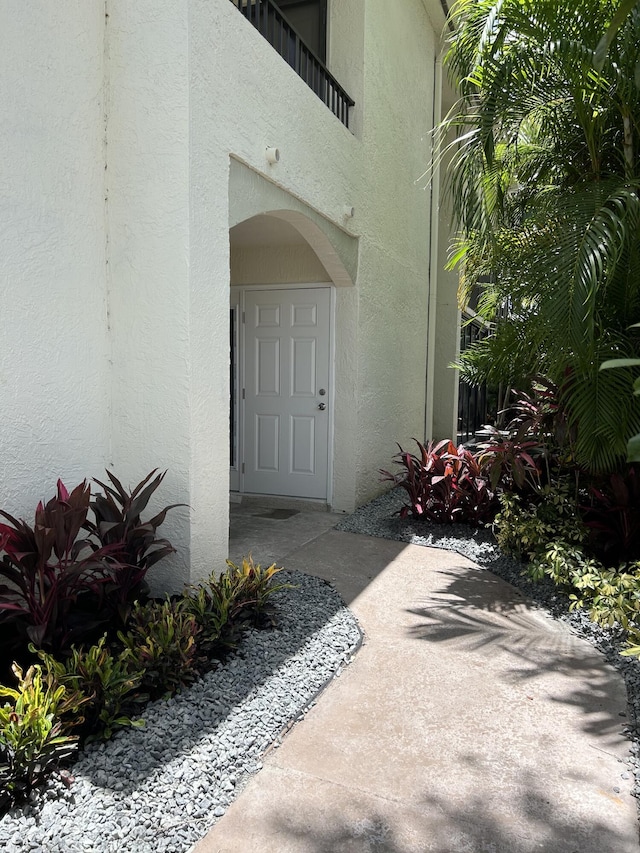 7458 Victory Ln Unit 10103, Delray Beach, FL 33446 - view of exterior entry featuring stucco siding