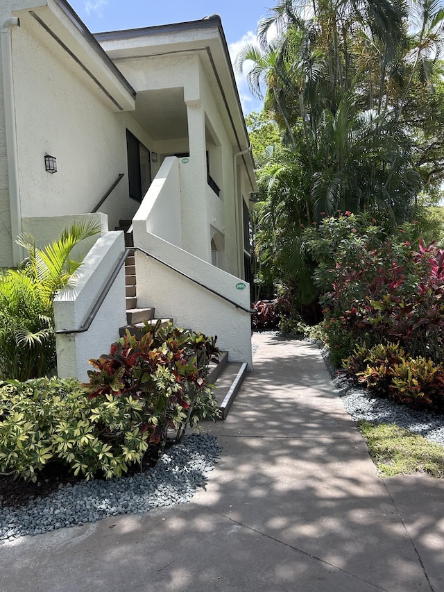7458 Victory Ln Unit 10103, Delray Beach, FL 33446 - view of side of property featuring stucco siding