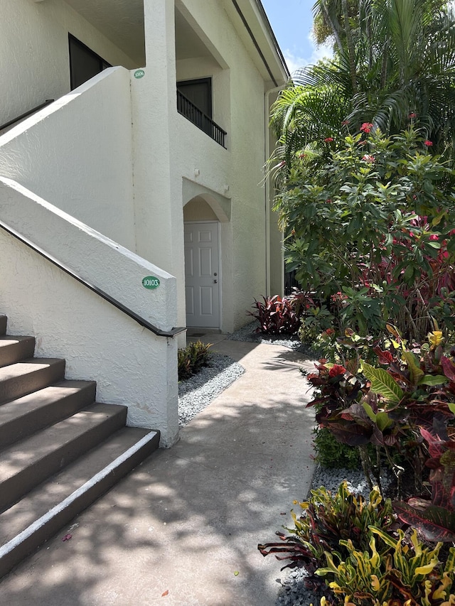 7458 Victory Ln Unit 10103, Delray Beach, FL 33446 - doorway to property featuring stucco siding