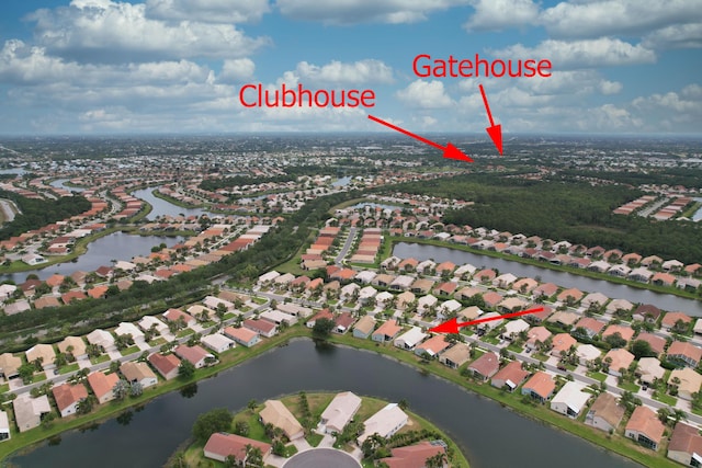 aerial view with a residential view and a water view