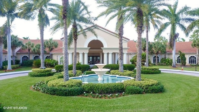 view of property's community with a yard