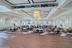 interior space with wood finished floors and coffered ceiling