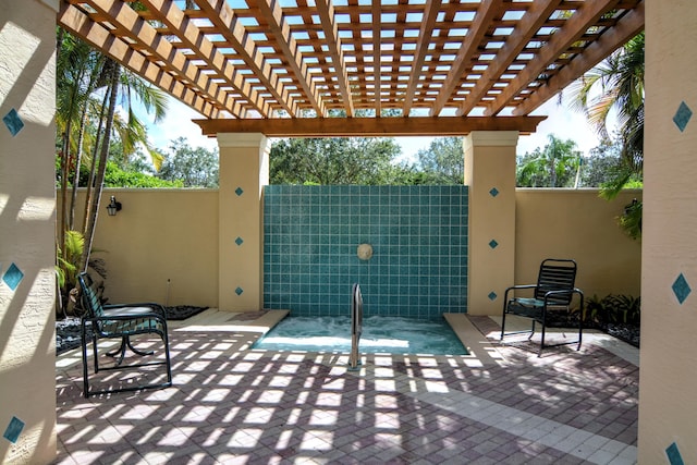 view of patio / terrace featuring fence and a pergola