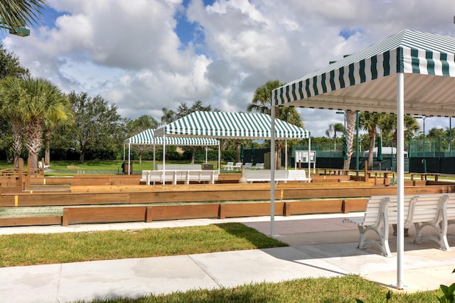 view of community featuring fence