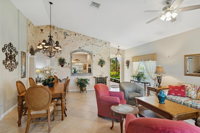 living room featuring light tile patterned floors, visible vents, high vaulted ceiling, and ceiling fan with notable chandelier