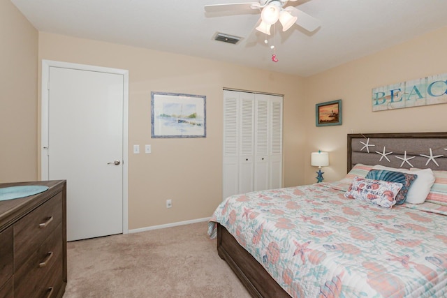 13 Lake Vista Trl Unit 202, Port Saint Lucie, FL 34952 - bedroom featuring a closet, light carpet, baseboards, visible vents, and a ceiling fan
