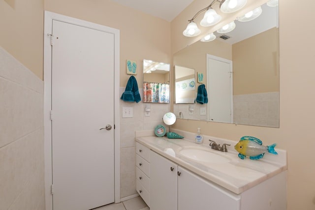 13 Lake Vista Trl Unit 202, Port Saint Lucie, FL 34952 - bathroom with tile walls, visible vents, and vanity