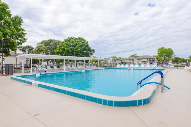 13 Lake Vista Trl Unit 202, Port Saint Lucie, FL 34952 - pool with fence and a patio