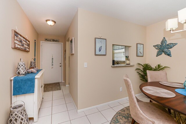 13 Lake Vista Trl Unit 202, Port Saint Lucie, FL 34952 - corridor with light tile patterned floors and baseboards