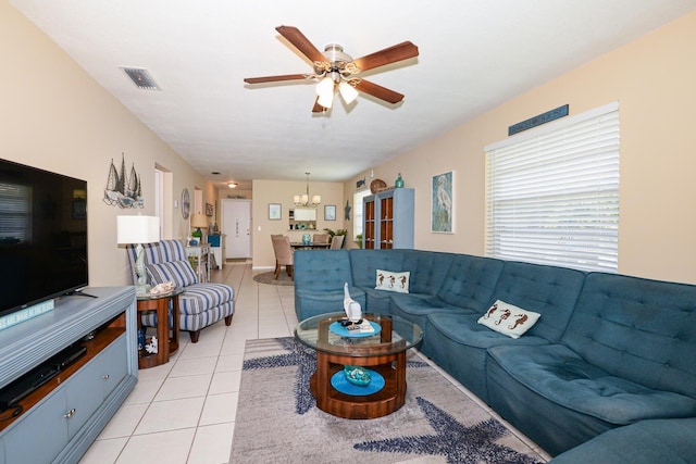 13 Lake Vista Trl Unit 202, Port Saint Lucie, FL 34952 - living area with visible vents, ceiling fan with notable chandelier, and light tile patterned flooring
