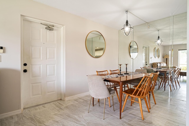 dining room featuring baseboards