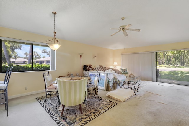 901 Club Dr, Palm Beach Gardens, FL 33418 - carpeted dining room with ceiling fan and baseboards