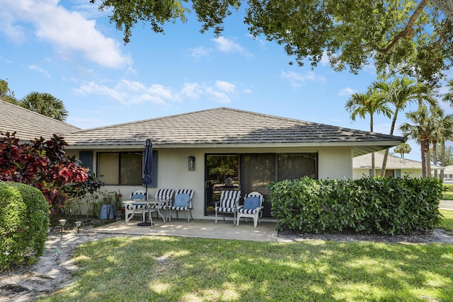 901 Club Dr, Palm Beach Gardens, FL 33418 - rear view of property with a lawn, a patio, and stucco siding