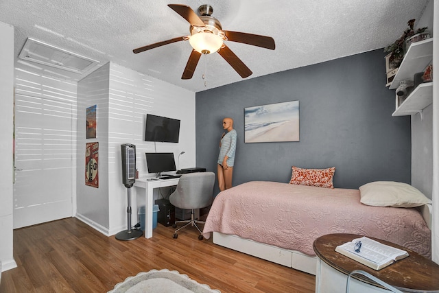 136 Centennial Ct, Deerfield Beach, FL 33442 - bedroom with wood finished floors, baseboards, attic access, a textured ceiling, and ceiling fan