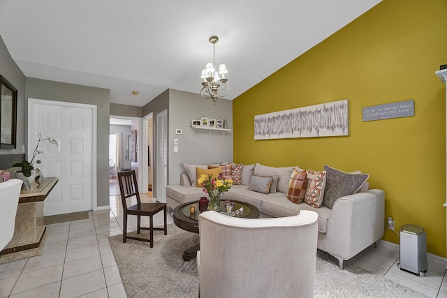 136 Centennial Ct, Deerfield Beach, FL 33442 - living area featuring light tile patterned flooring, vaulted ceiling, baseboards, and an inviting chandelier