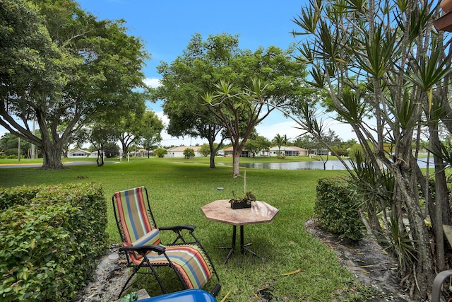 136 Centennial Ct, Deerfield Beach, FL 33442 - surrounding community featuring a lawn and a water view