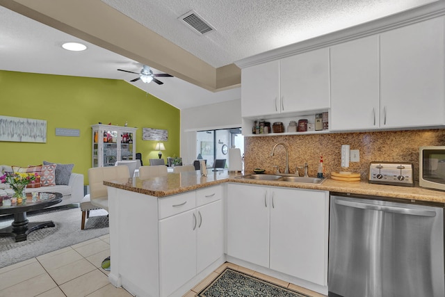 136 Centennial Ct, Deerfield Beach, FL 33442 - kitchen with lofted ceiling, visible vents, a sink, a peninsula, and appliances with stainless steel finishes