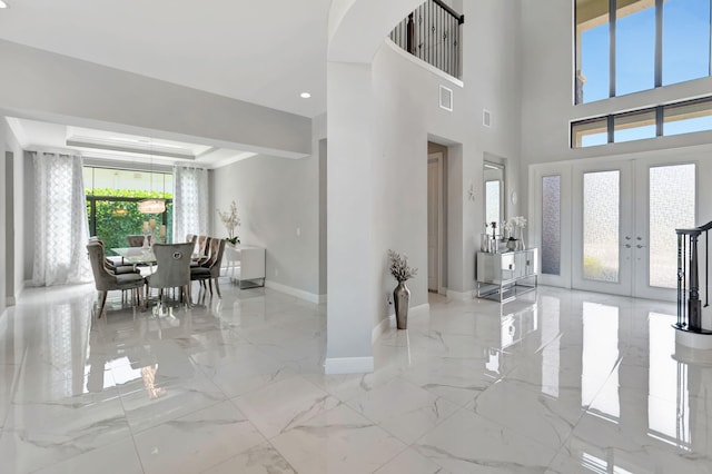 7015 NW 27th Ave, Boca Raton, FL 33496 - entryway with marble finish floor, baseboards, visible vents, french doors, and a tray ceiling