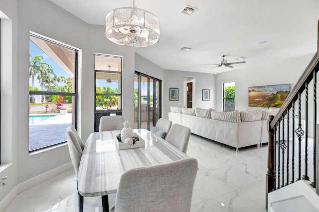 7015 NW 27th Ave, Boca Raton, FL 33496 - dining area featuring marble finish floor, visible vents, ceiling fan with notable chandelier, and baseboards
