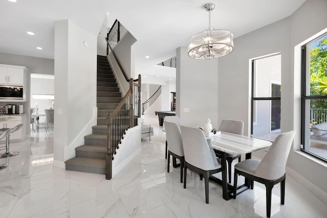 7015 NW 27th Ave, Boca Raton, FL 33496 - dining area featuring a chandelier, stairway, recessed lighting, and marble finish floor