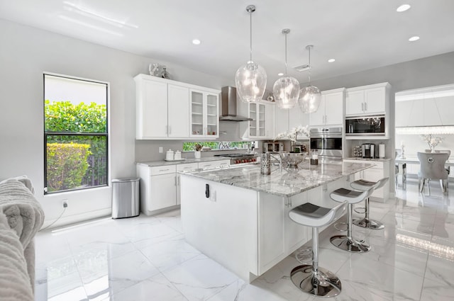 7015 NW 27th Ave, Boca Raton, FL 33496 - kitchen with recessed lighting, oven, wall chimney exhaust hood, black microwave, and marble finish floor