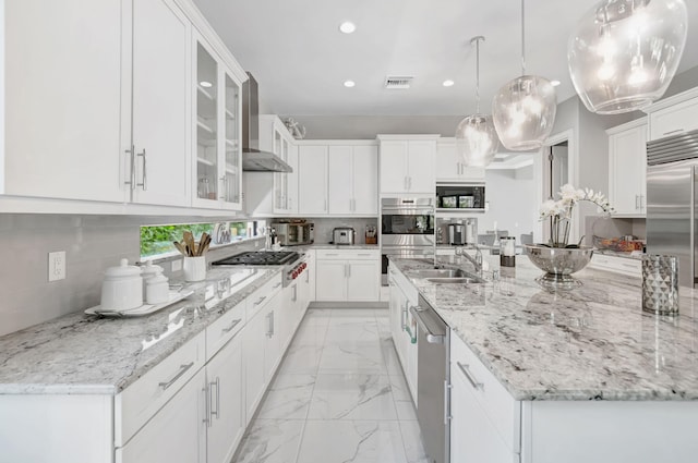7015 NW 27th Ave, Boca Raton, FL 33496 - kitchen featuring recessed lighting, appliances with stainless steel finishes, marble finish floor, visible vents, and wall chimney exhaust hood