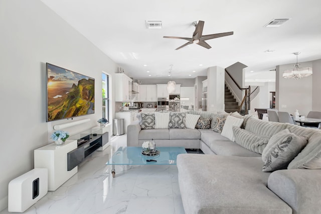 7015 NW 27th Ave, Boca Raton, FL 33496 - living area with stairway, visible vents, recessed lighting, and ceiling fan with notable chandelier