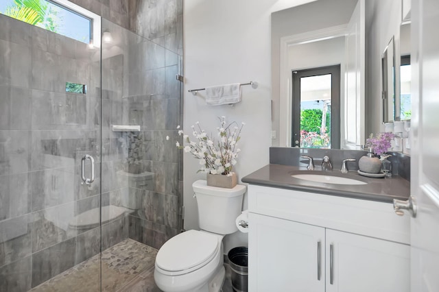 7015 NW 27th Ave, Boca Raton, FL 33496 - bathroom featuring toilet, a stall shower, and vanity