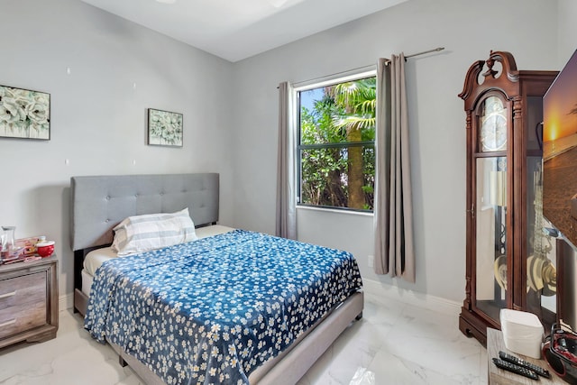 7015 NW 27th Ave, Boca Raton, FL 33496 - bedroom with baseboards and marble finish floor