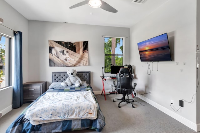 7015 NW 27th Ave, Boca Raton, FL 33496 - carpeted bedroom with baseboards, visible vents, and ceiling fan