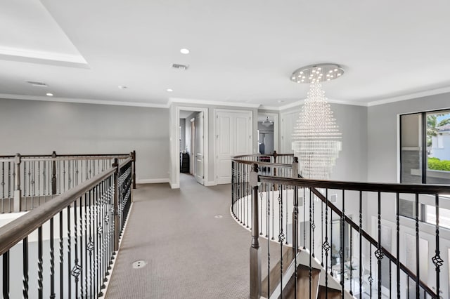 7015 NW 27th Ave, Boca Raton, FL 33496 - hallway with an upstairs landing, a notable chandelier, crown molding, visible vents, and carpet