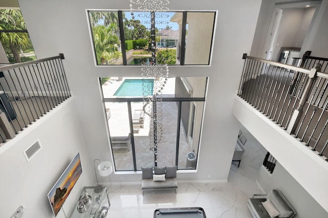 7015 NW 27th Ave, Boca Raton, FL 33496 - interior space with baseboards, visible vents, a chandelier, and marble finish floor
