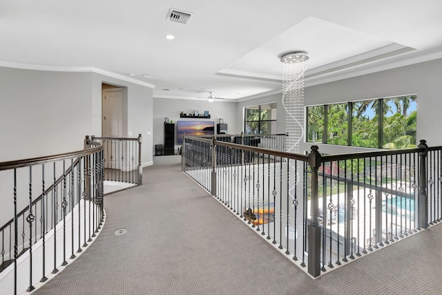7015 NW 27th Ave, Boca Raton, FL 33496 - corridor featuring an upstairs landing, carpet flooring, baseboards, visible vents, and crown molding