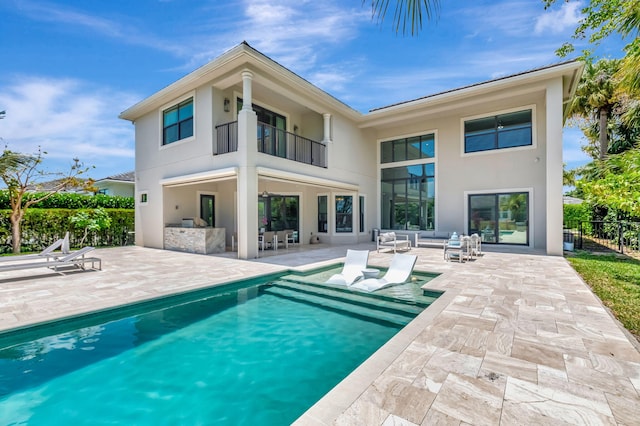 7015 NW 27th Ave, Boca Raton, FL 33496 - rear view of house with a patio, a balcony, an outdoor living space, an outdoor pool, and stucco siding