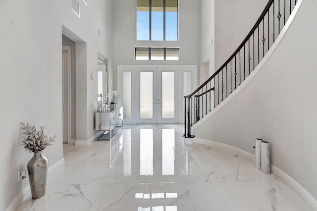 7015 NW 27th Ave, Boca Raton, FL 33496 - foyer with visible vents, french doors, a high ceiling, marble finish floor, and stairs