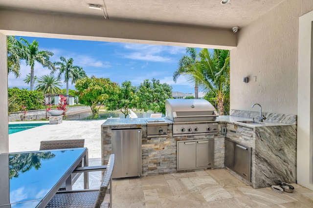 7015 NW 27th Ave, Boca Raton, FL 33496 - view of patio featuring exterior kitchen, area for grilling, and a sink