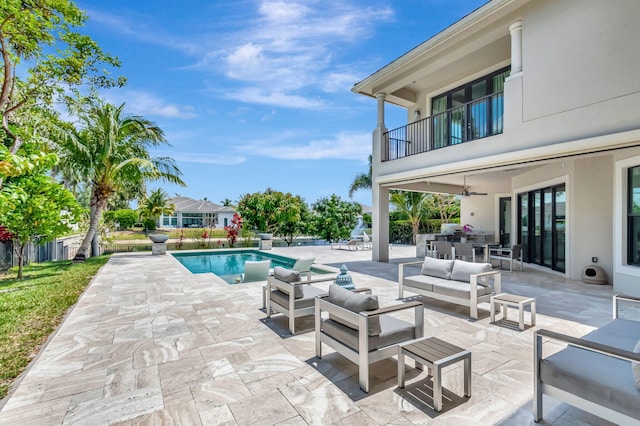 7015 NW 27th Ave, Boca Raton, FL 33496 - pool with a patio, an outdoor living space, ceiling fan, and exterior kitchen