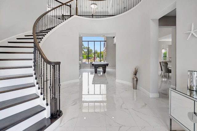 7015 NW 27th Ave, Boca Raton, FL 33496 - entryway featuring stairway, a high ceiling, pool table, and marble finish floor