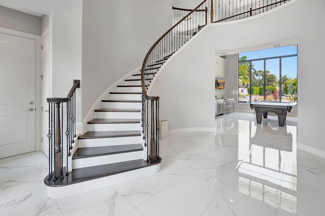 7015 NW 27th Ave, Boca Raton, FL 33496 - stairway featuring a towering ceiling, marble finish floor, baseboards, and pool table