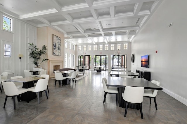 7015 NW 27th Ave, Boca Raton, FL 33496 - dining space featuring a towering ceiling, baseboards, and plenty of natural light