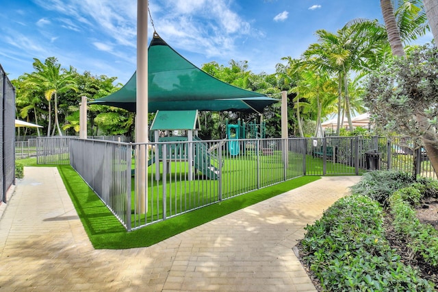 7015 NW 27th Ave, Boca Raton, FL 33496 - view of community with fence, playground community, and a yard