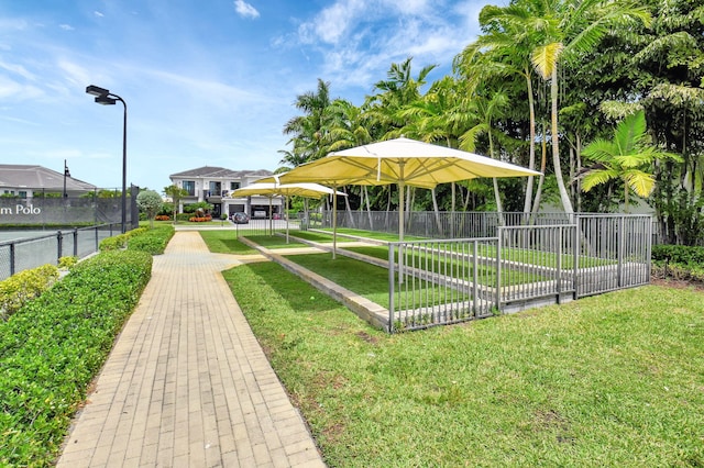 7015 NW 27th Ave, Boca Raton, FL 33496 - view of community featuring a yard and fence