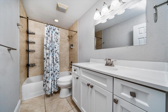 bathroom featuring shower / bath combo, vanity, tile patterned floors, toilet, and visible vents