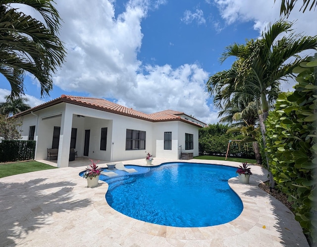 view of swimming pool with a fenced in pool and a patio area
