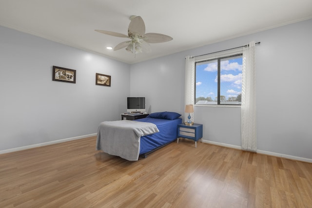 bedroom with light wood-type flooring, baseboards, recessed lighting, a ceiling fan, and crown molding