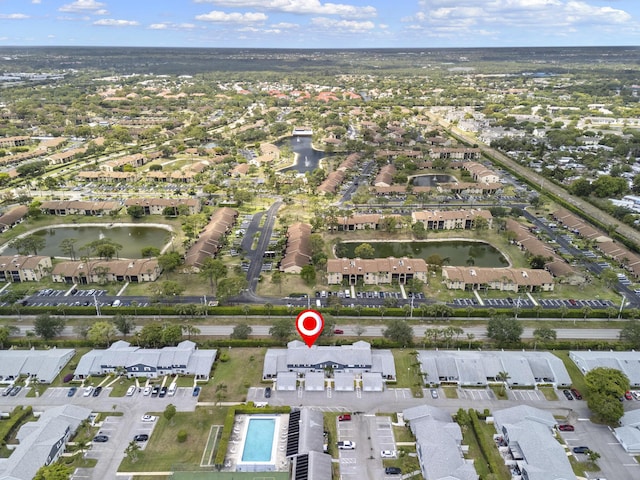 birds eye view of property featuring a residential view and a water view