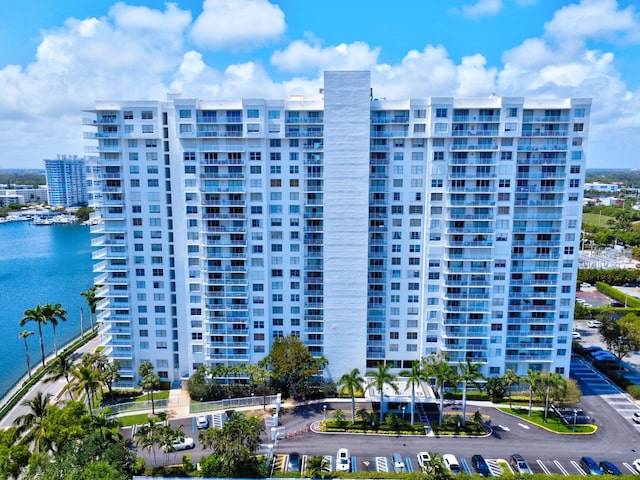 view of property featuring a water view and a city view