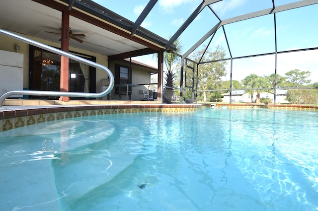 outdoor pool with a ceiling fan and a lanai