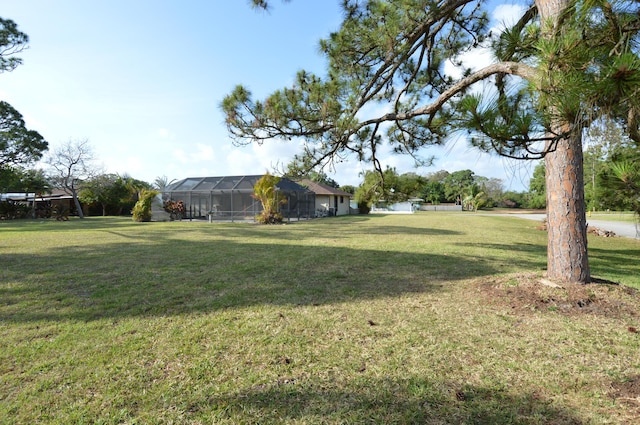 view of yard with a lanai